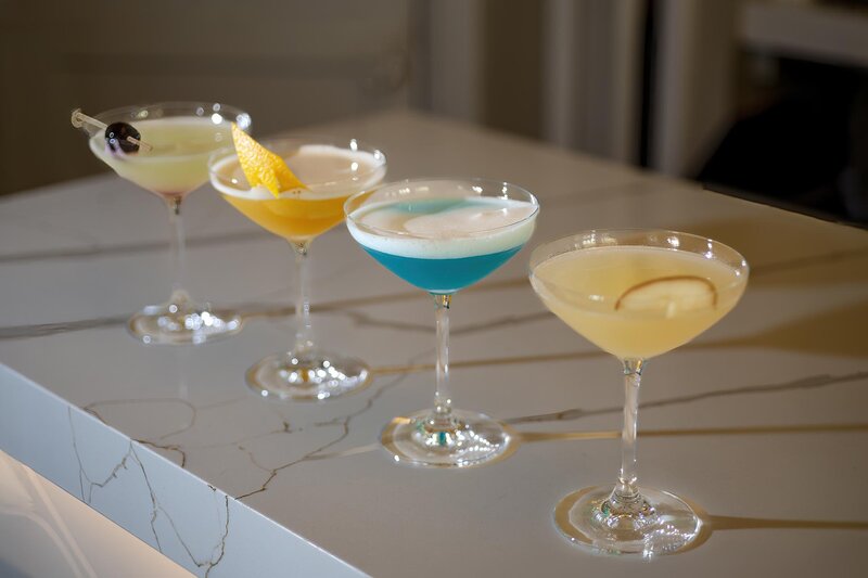 Four cocktails on bar
