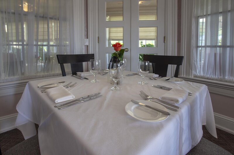 Table set for four guests with flower center peice